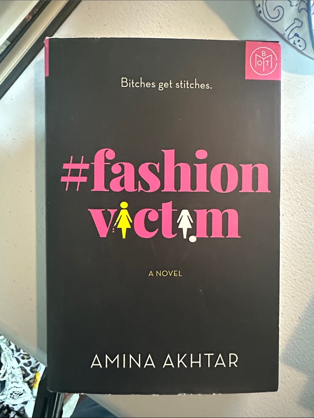 #fashion victim by Amina Akhtar - Black Cover with Pink & Yellow Accents